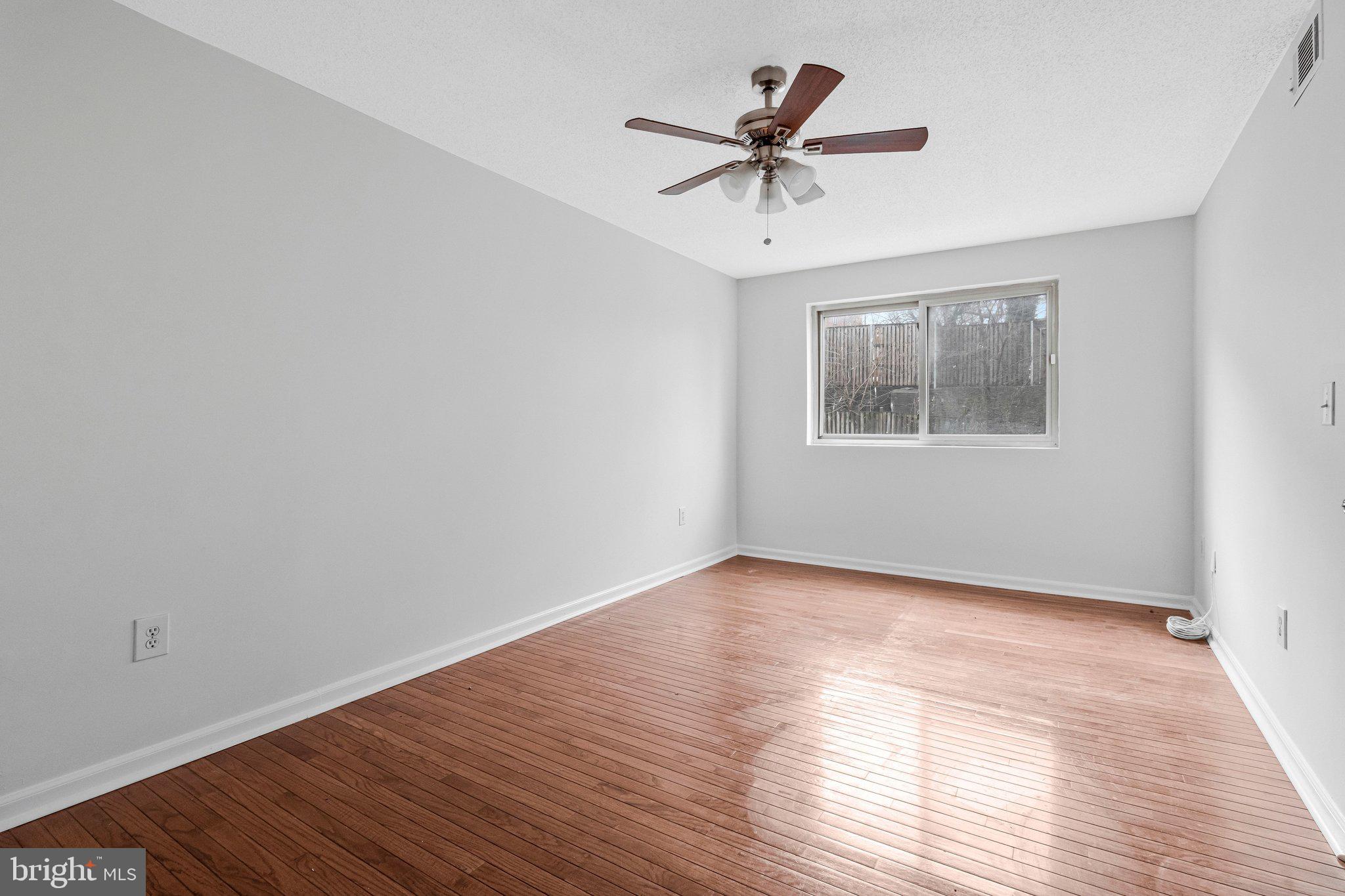 2608 Wade Road Southeast, Unit 202 Washington, DC 20020 - Photo 17 of 25 a view of empty room with wooden floor and fan