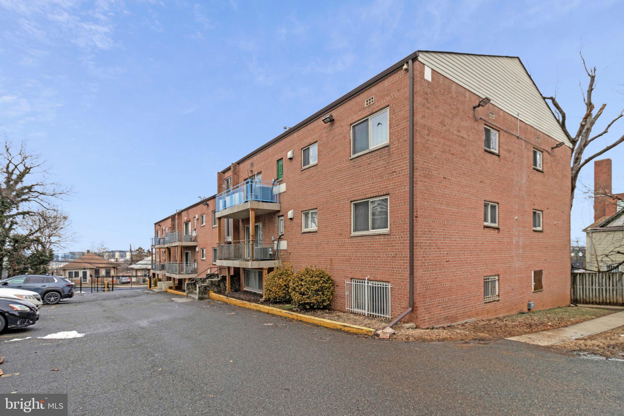 2608 Wade Road Southeast, Unit 202 Washington, DC 20020 - Photo 25 of 25 a large building with a street