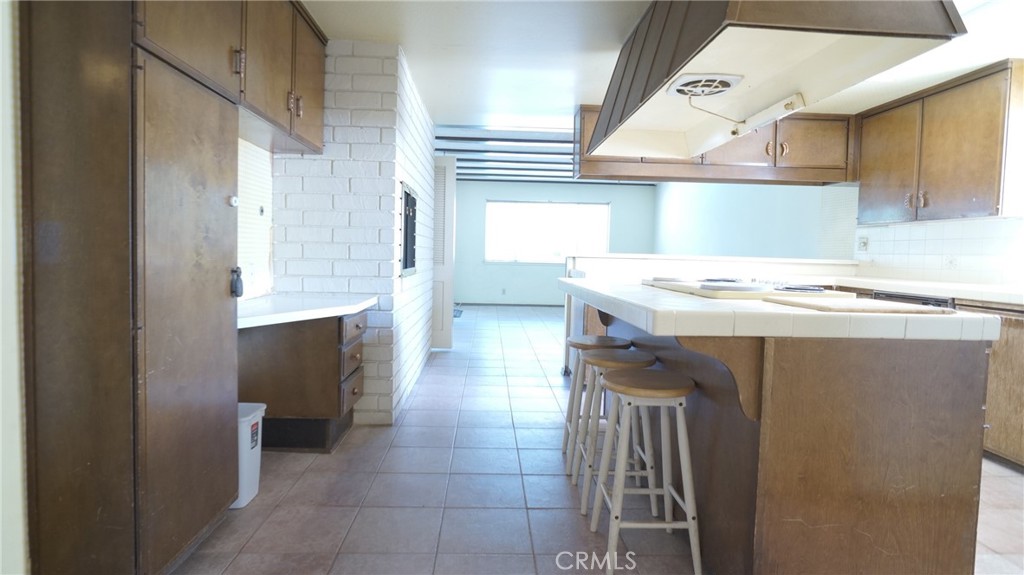 20522 Seton Hill Drive Walnut, CA 91789 - Photo 9 of 51 a kitchen with a sink a stove top oven and cabinets