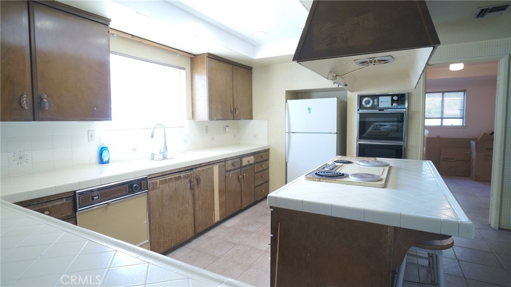 20522 Seton Hill Drive Walnut, CA 91789 - Photo 10 of 51 a kitchen with a sink stove and cabinets