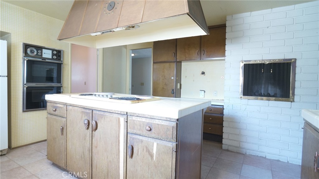 20522 Seton Hill Drive Walnut, CA 91789 - Photo 13 of 51 a kitchen with a sink and a refrigerator