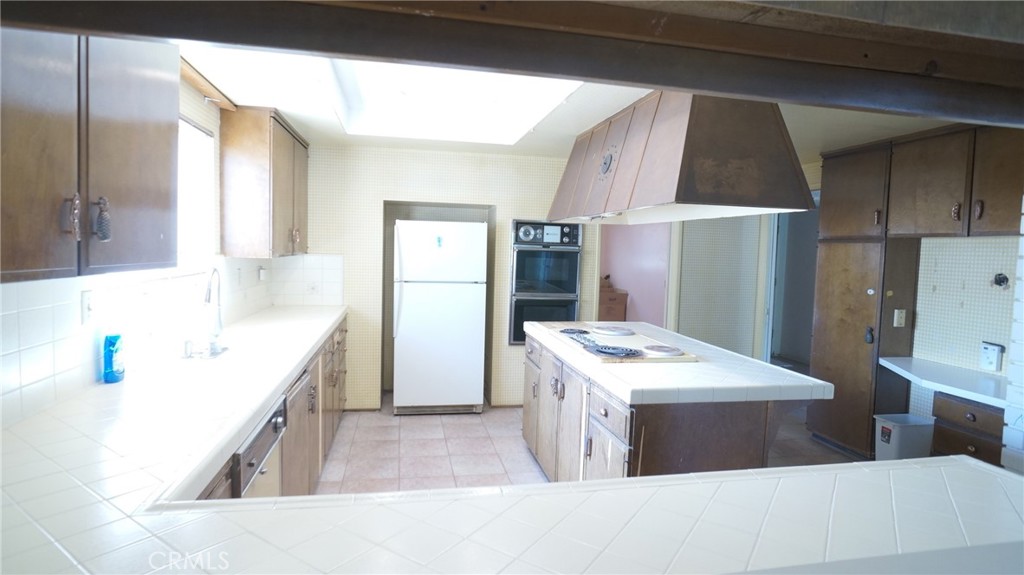 20522 Seton Hill Drive Walnut, CA 91789 - Photo 14 of 51 a kitchen with a sink stove and refrigerator