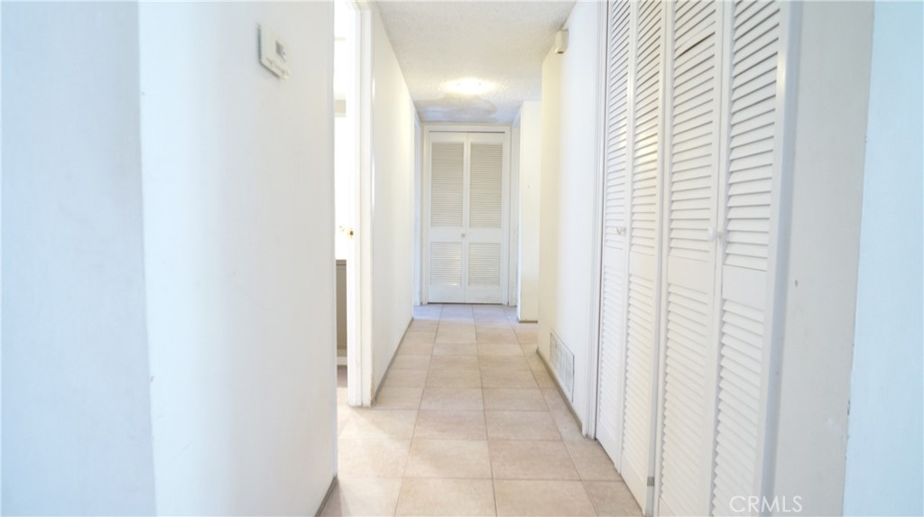 20522 Seton Hill Drive Walnut, CA 91789 - Photo 31 of 51 a view of a hallway with a white door