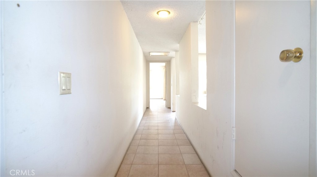 20522 Seton Hill Drive Walnut, CA 91789 - Photo 32 of 51 a view of a hallway with wooden floor