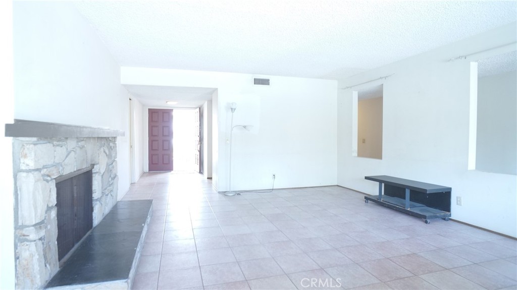 20522 Seton Hill Drive Walnut, CA 91789 - Photo 4 of 51 a view of a livingroom with an empty space and a fireplace
