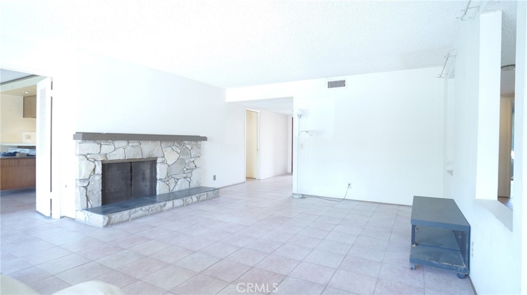 20522 Seton Hill Drive Walnut, CA 91789 - Photo 7 of 51 a view of an empty room with window and a fireplace