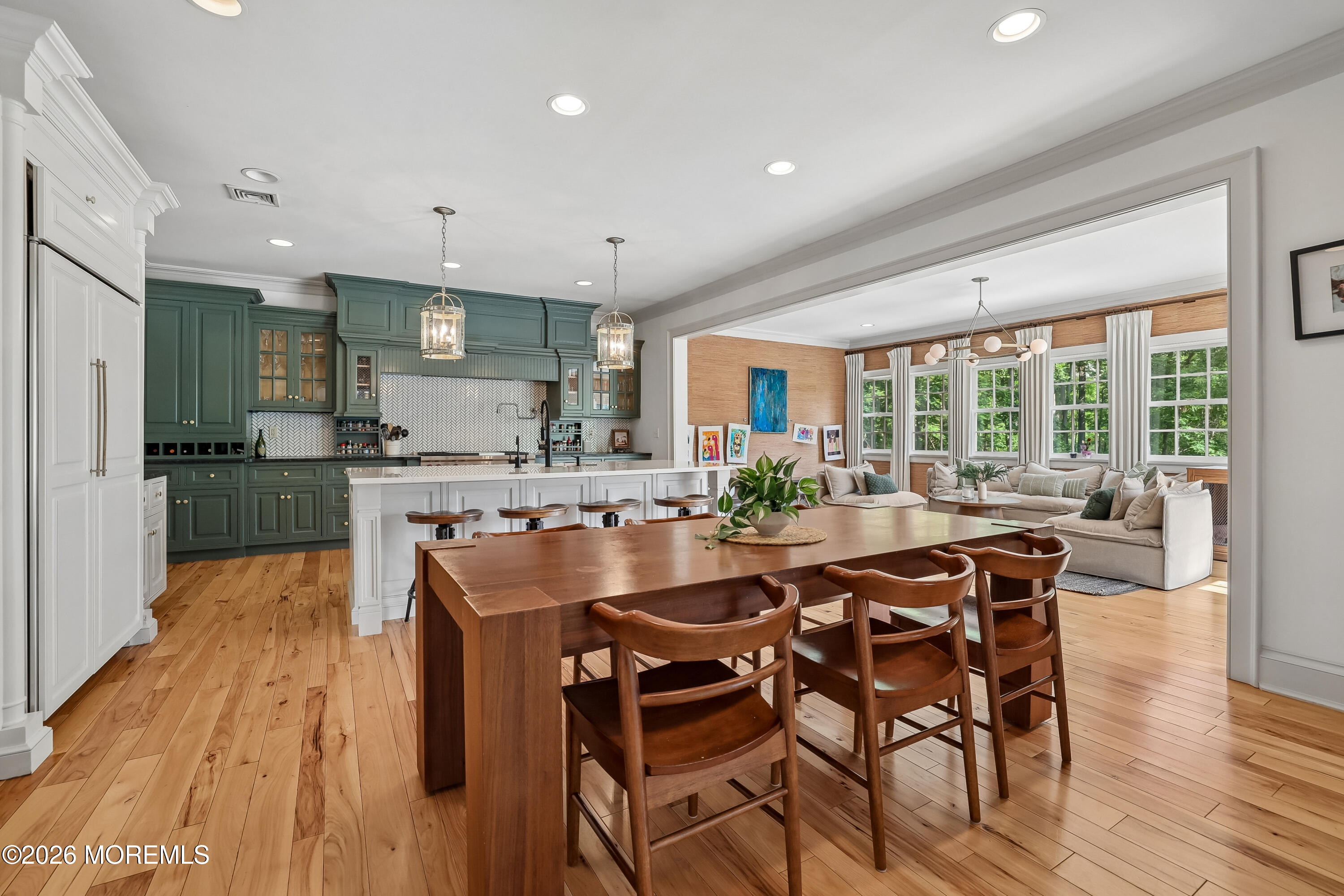 92 Tulip Lane Colts Neck, NJ 07722 - Photo 11 of 55 a kitchen with stainless steel appliances granite countertop table chairs and wooden floor