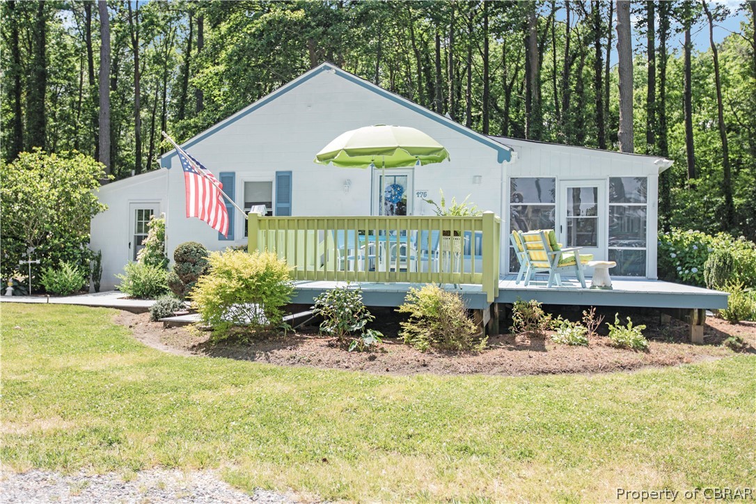 175 Seaside Way Gwynn, VA 23076 - Photo 30 of 48 a front view of a house with a garden and sitting area