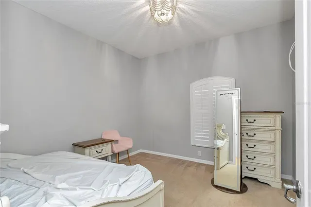 a large kitchen with stainless steel appliances granite countertop a refrigerator and a sink