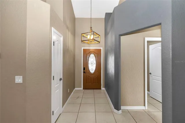 a hallway with sliding door and shower