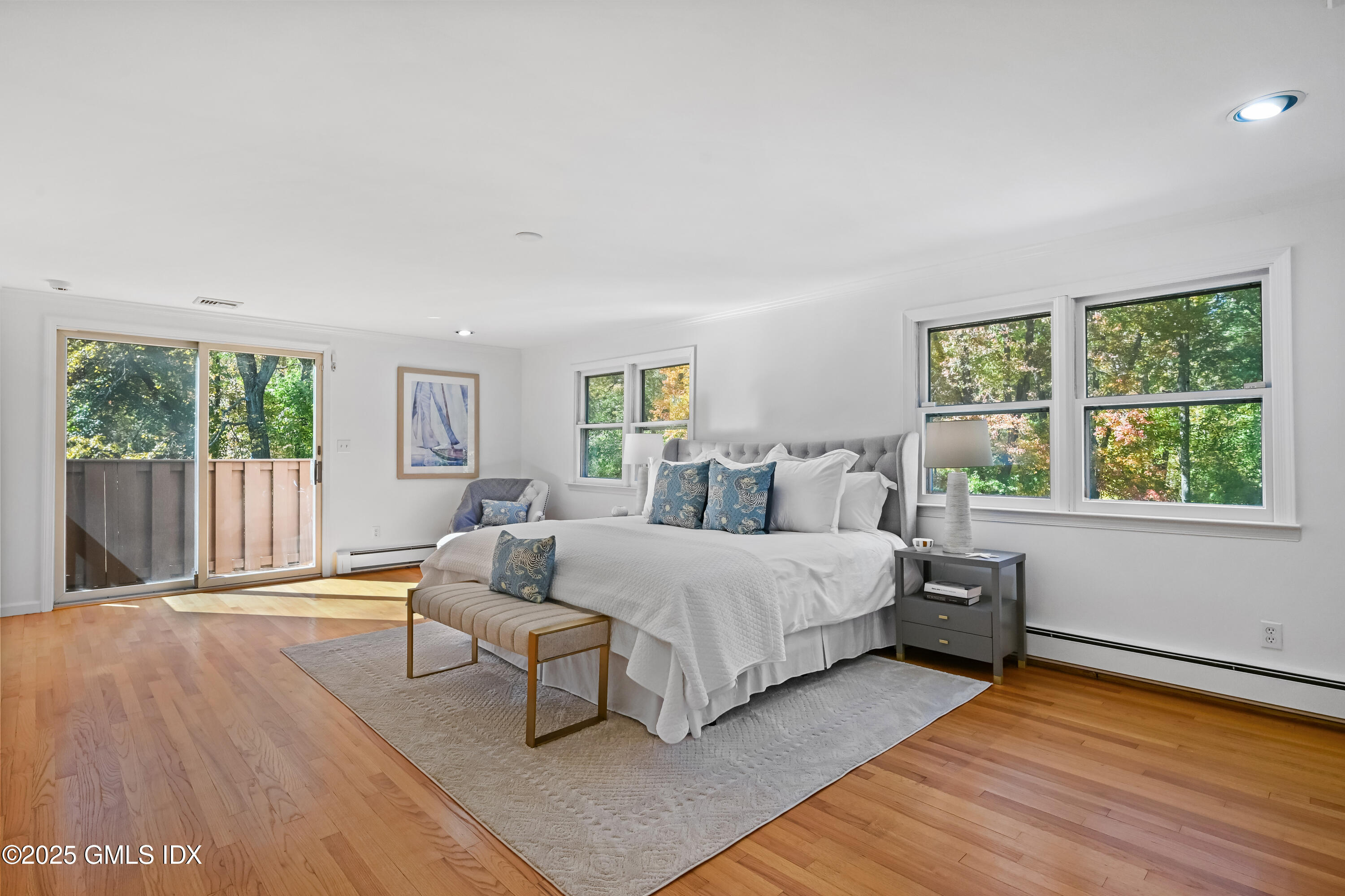 38 Bedford Road Greenwich, CT 06831 - Photo 16 of 32 a spacious bedroom with a bed and a large window
