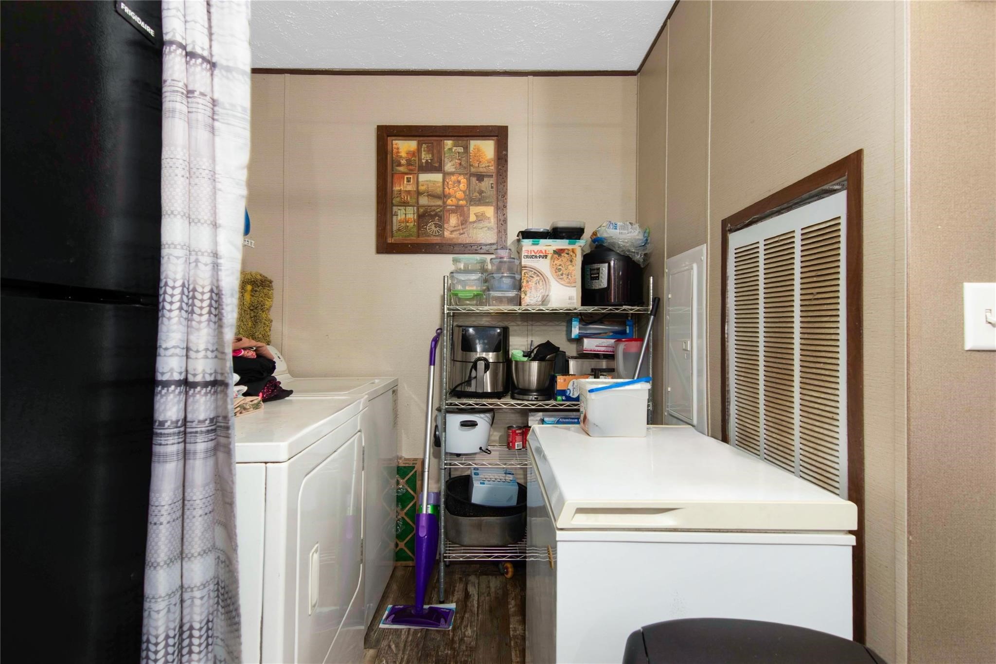 18093 Pickering Road Conroe, TX 77302 - Photo 18 of 29 a view of storage and utility room with washer and dryer