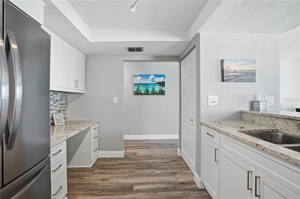16330 Gulf Boulevard, Unit 306 Redington Beach, FL 33708 - Photo 16 of 39 a kitchen with a sink and a refrigerator