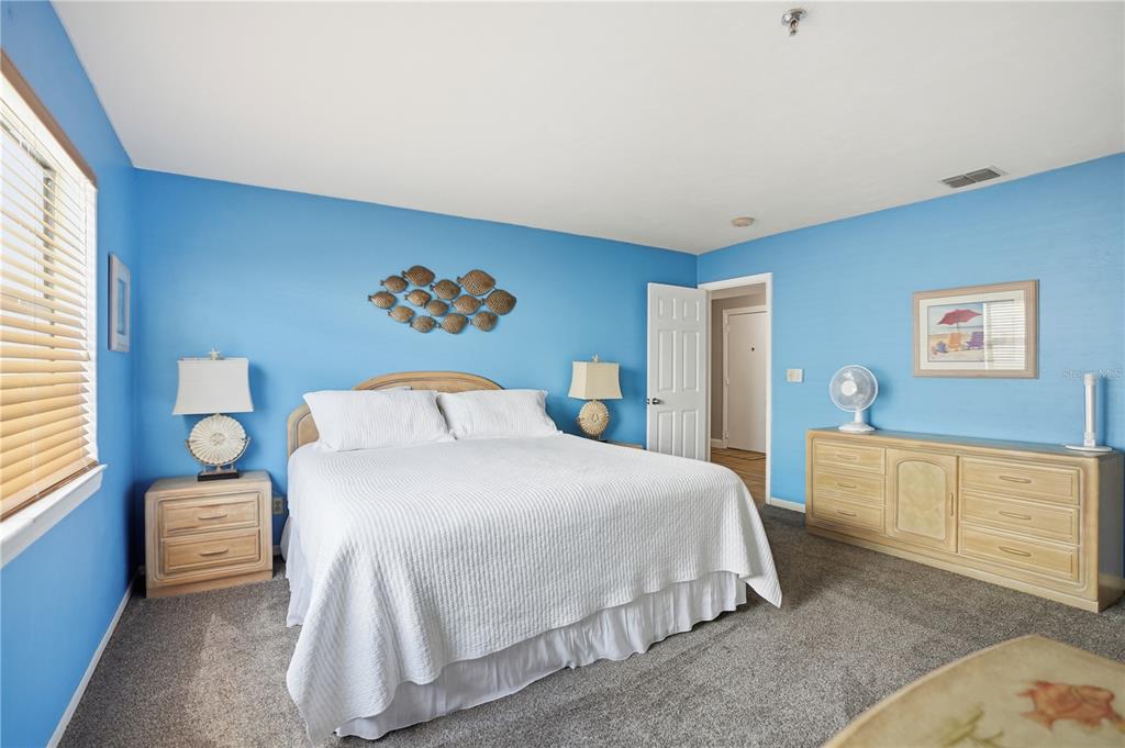 16330 Gulf Boulevard, Unit 306 Redington Beach, FL 33708 - Photo 21 of 39 a bedroom with a bed and window