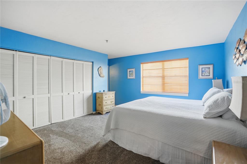 16330 Gulf Boulevard, Unit 306 Redington Beach, FL 33708 - Photo 22 of 39 a bedroom with a bed and a window