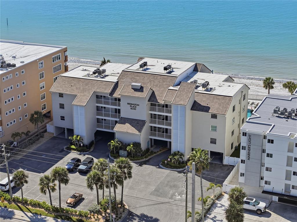 16330 Gulf Boulevard, Unit 306 Redington Beach, FL 33708 - Photo 38 of 39 an aerial view of a house with a yard