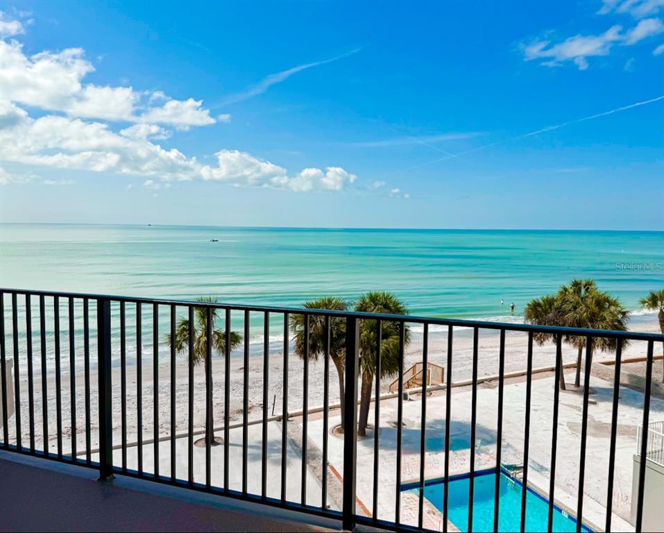 16330 Gulf Boulevard, Unit 306 Redington Beach, FL 33708 - Photo 6 of 39 a balcony with an ocean view