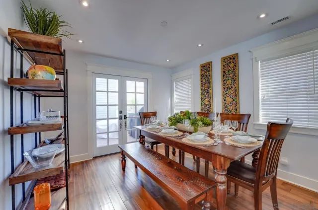 a view of a dining room with furniture and window