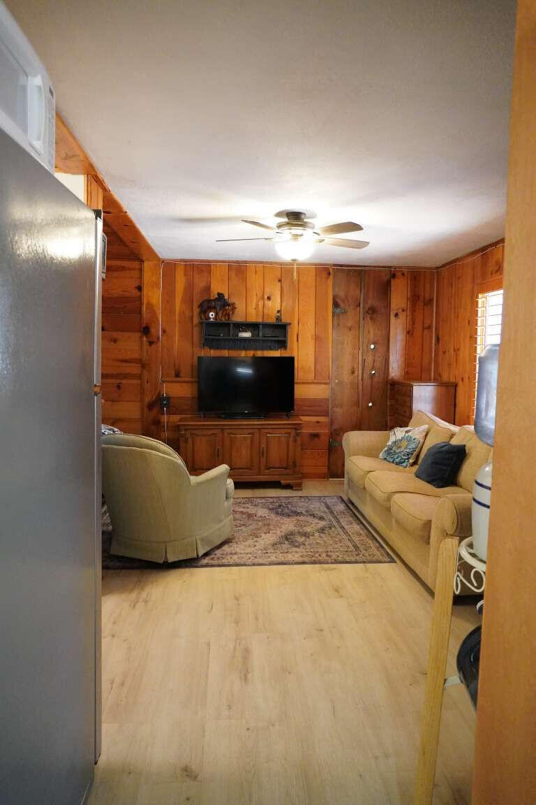 167 South Ranch Lane Payson, AZ 85541 - Photo 23 of 40 a living room with furniture and a flat screen tv