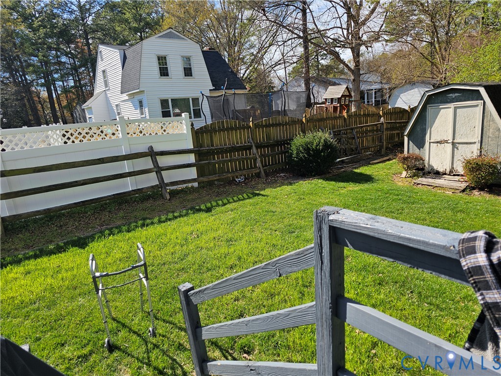 8996 Tameo Road Glen Allen, VA 23060 - Photo 8 of 45 a front view of a house with garden