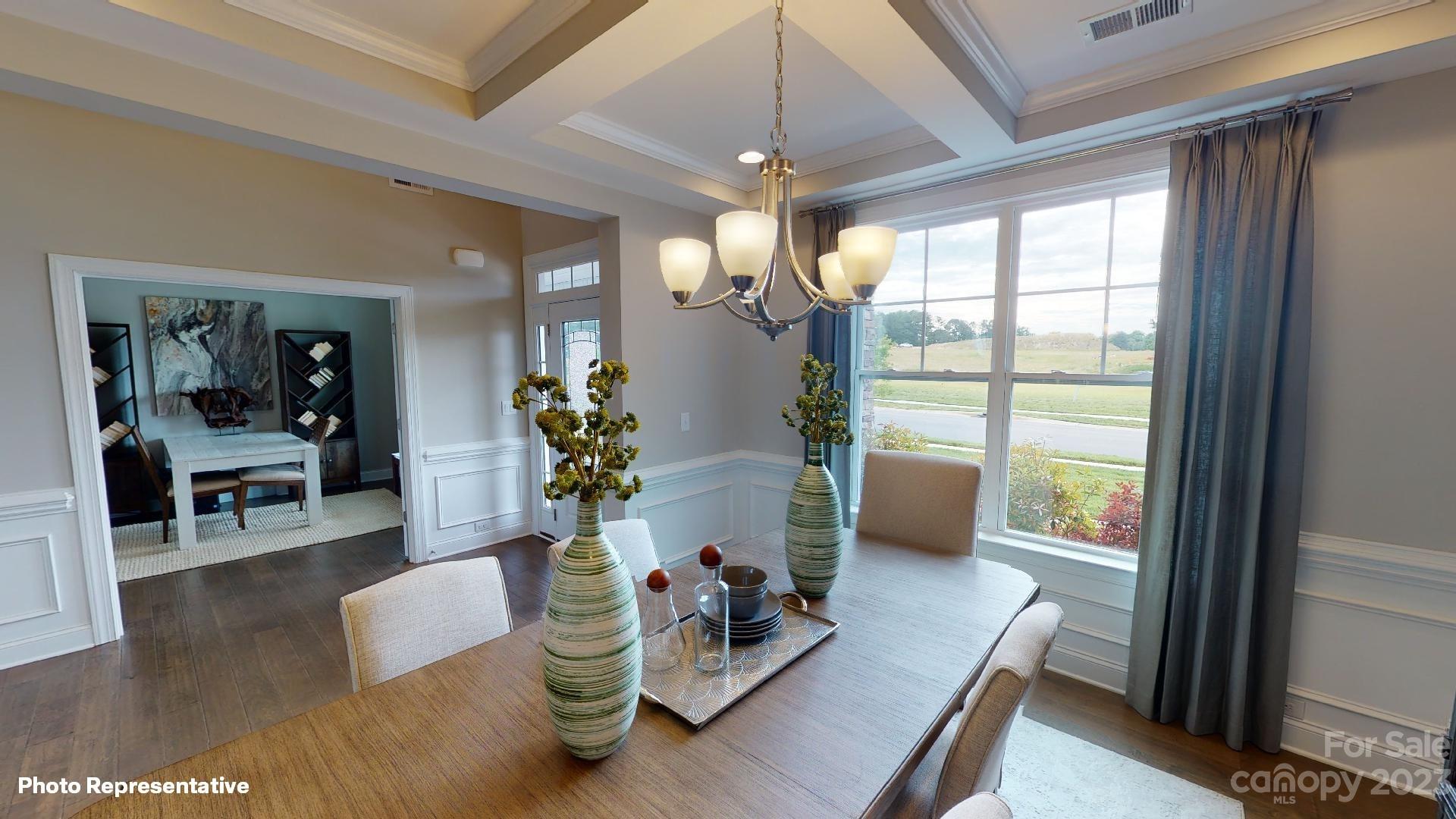 384 Streamwood Road Troutman, NC 28166 - Photo 11 of 36 a living room with furniture and a large window