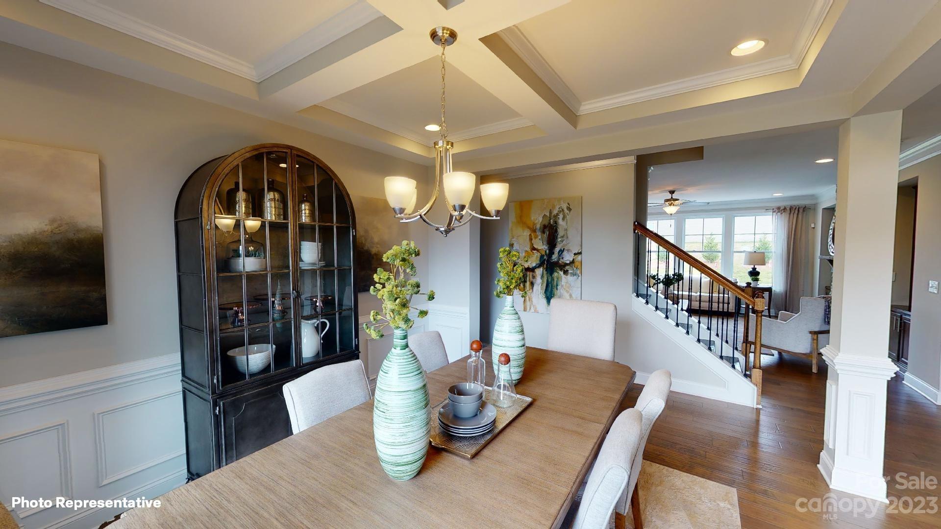 384 Streamwood Road Troutman, NC 28166 - Photo 12 of 36 a dining room with furniture and wooden floor