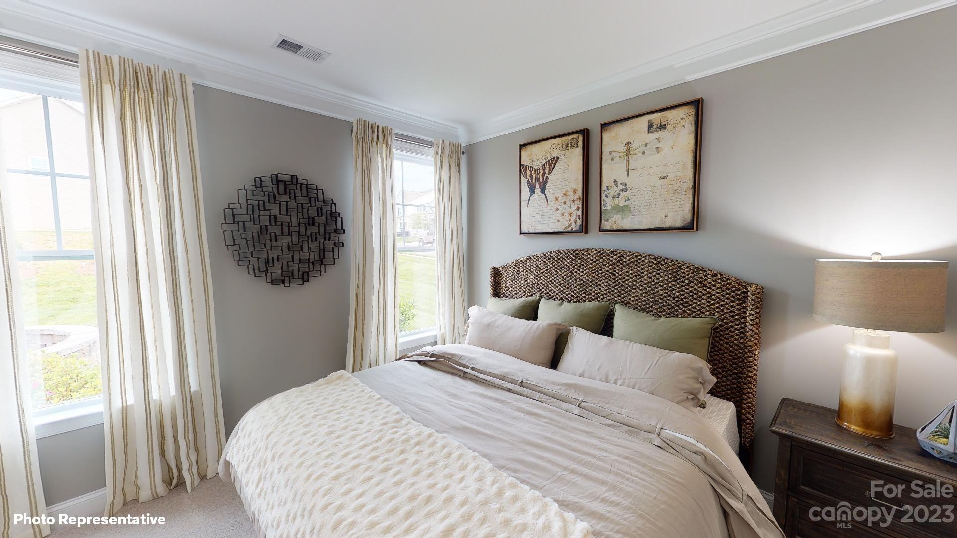 384 Streamwood Road Troutman, NC 28166 - Photo 13 of 36 a bedroom with a bed and a window