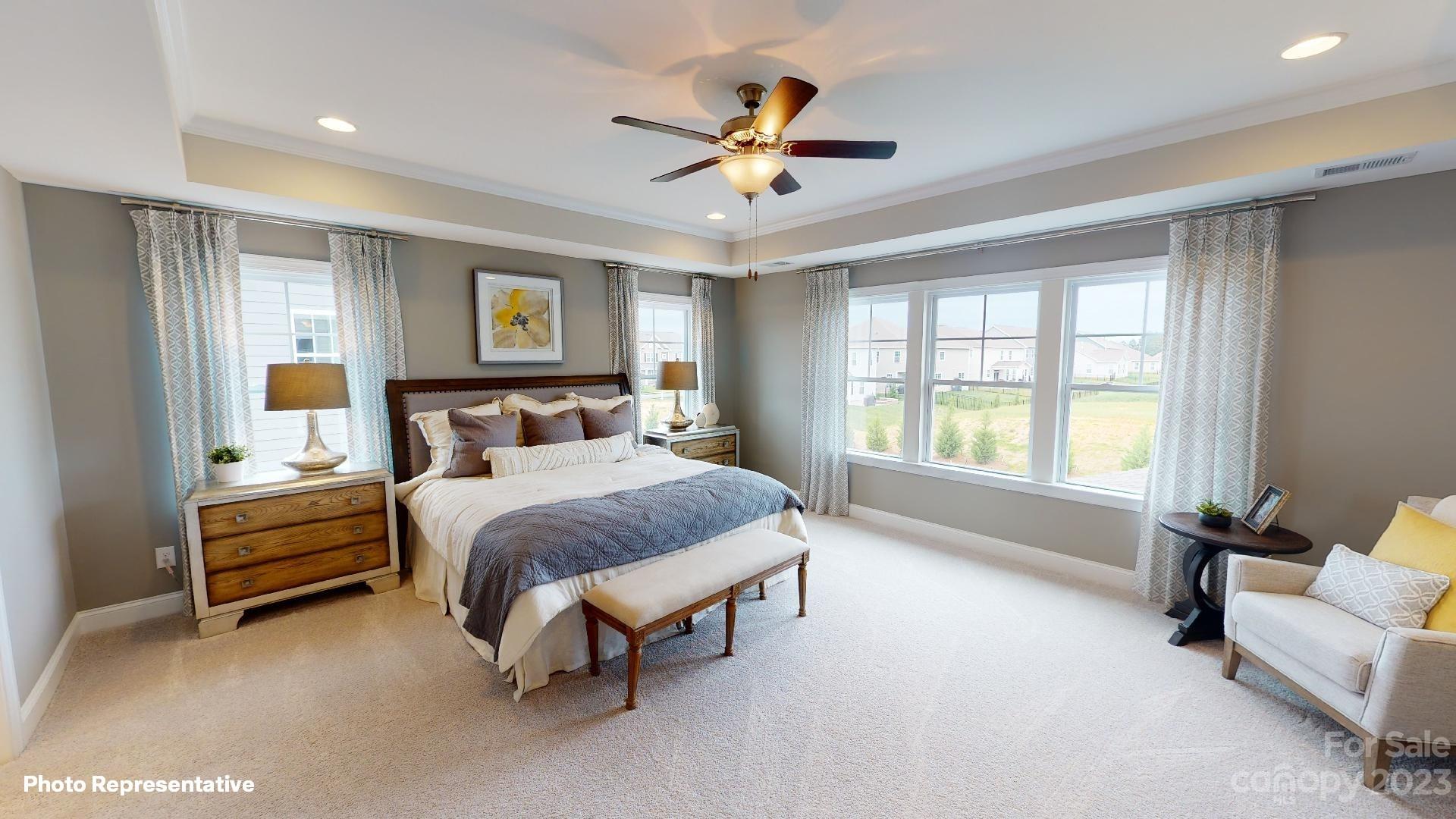 384 Streamwood Road Troutman, NC 28166 - Photo 15 of 36 a bedroom with a bed and a couch