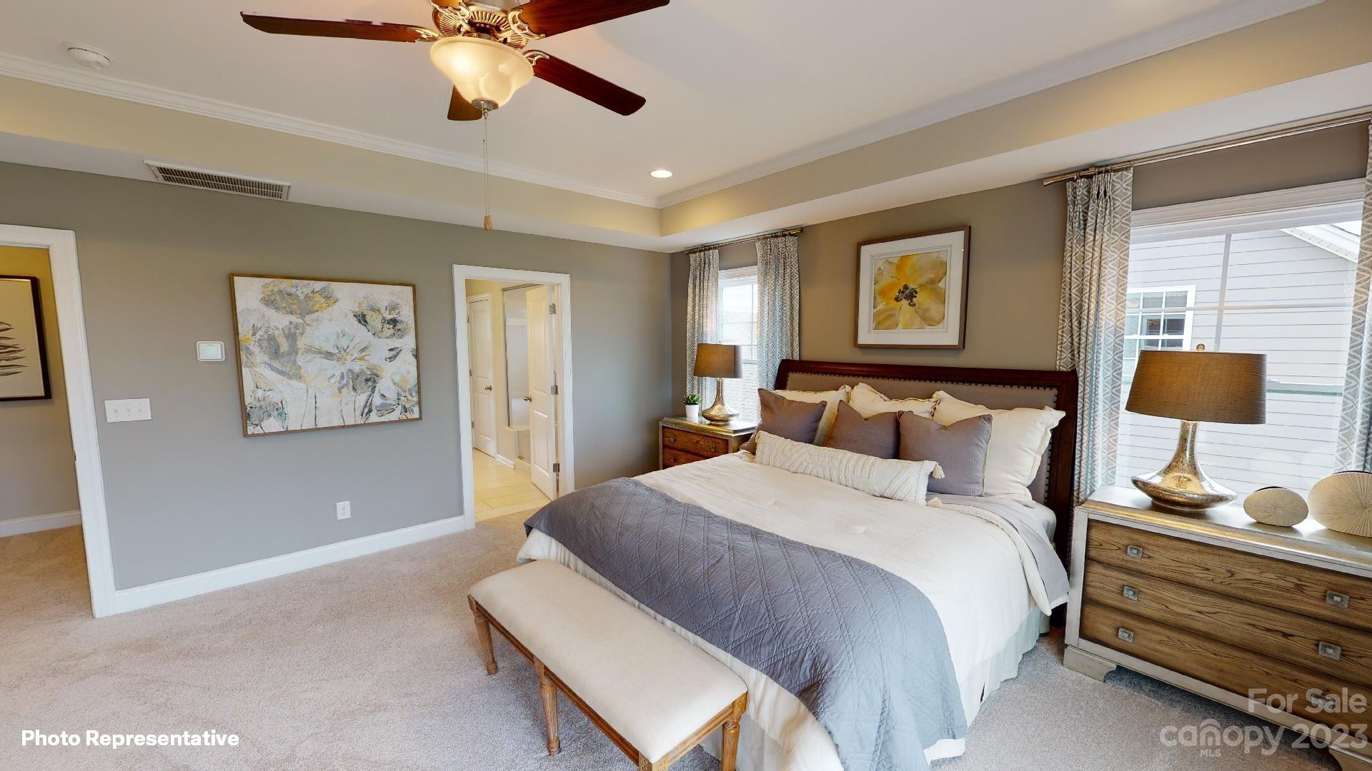 384 Streamwood Road Troutman, NC 28166 - Photo 16 of 36 a bedroom with a bed and painting on the wall