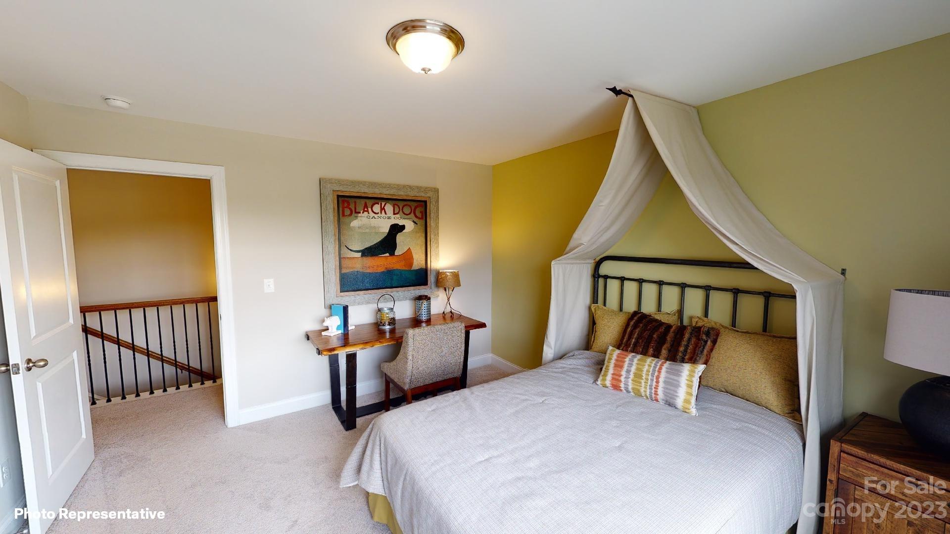 384 Streamwood Road Troutman, NC 28166 - Photo 19 of 36 a bedroom with furniture and a window