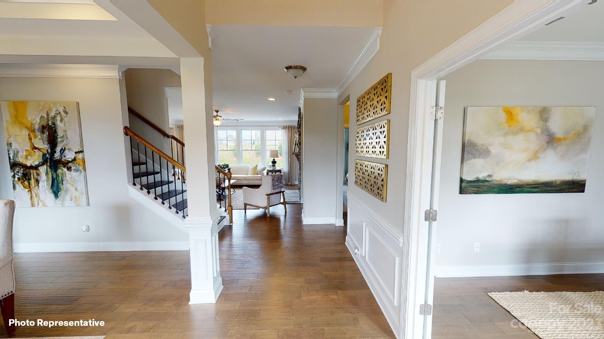 384 Streamwood Road Troutman, NC 28166 - Photo 2 of 36 a view of livingroom with furniture and floor to ceiling window