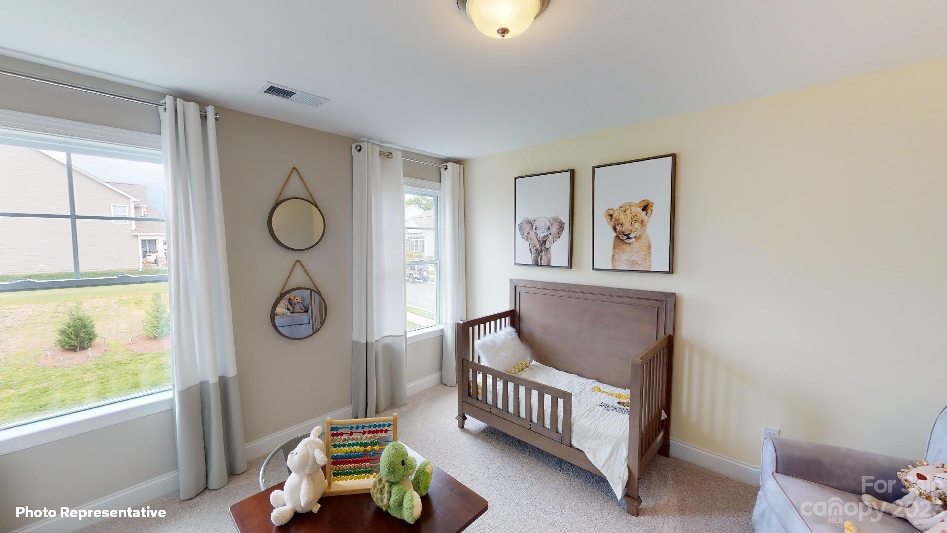 384 Streamwood Road Troutman, NC 28166 - Photo 23 of 36 a living room with furniture and a window