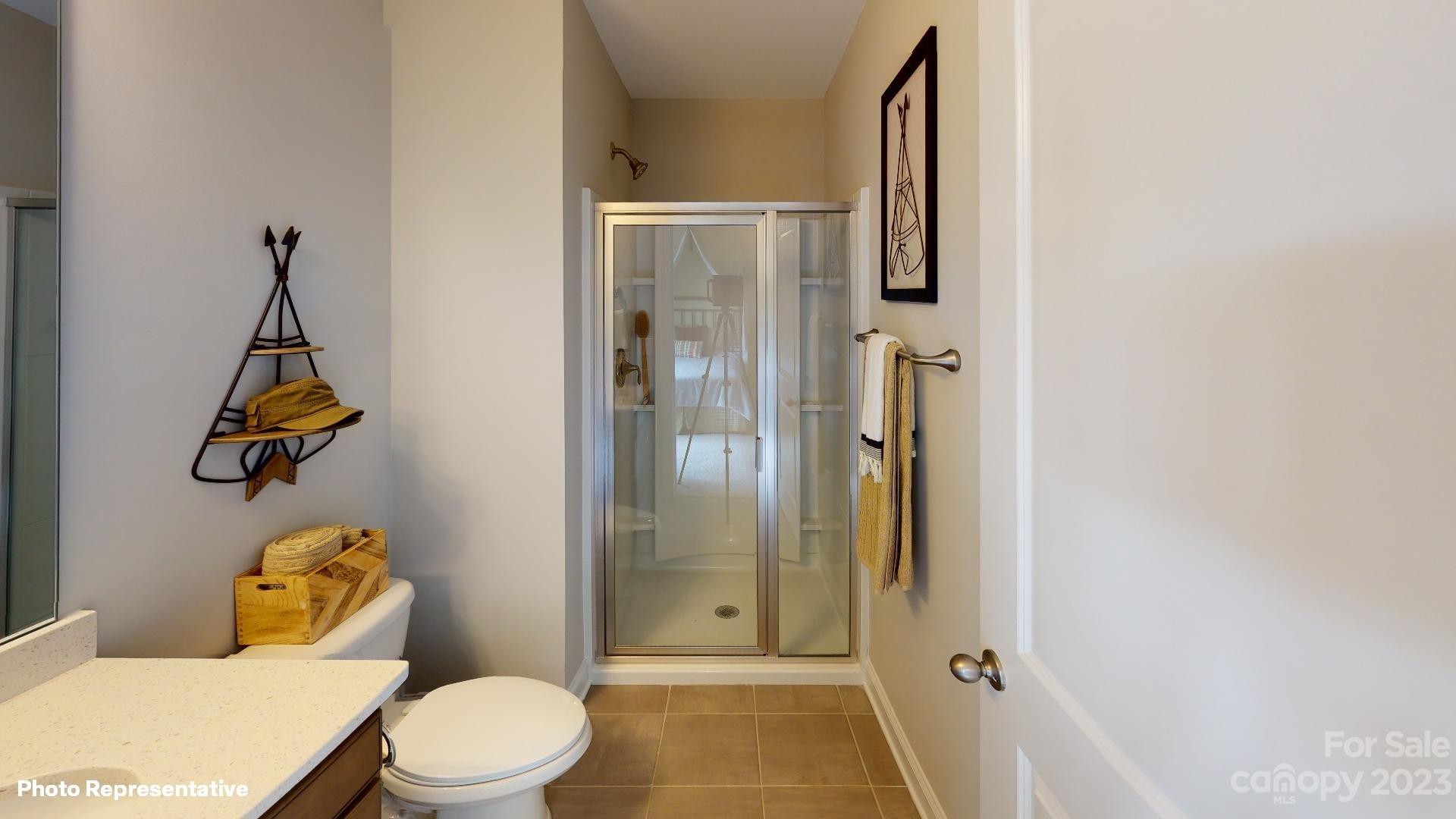 384 Streamwood Road Troutman, NC 28166 - Photo 29 of 36 a bathroom with a toilet and shower