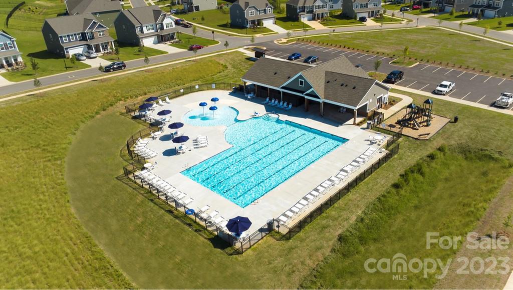 384 Streamwood Road Troutman, NC 28166 - Photo 32 of 36 a view of a swimming pool with a yard