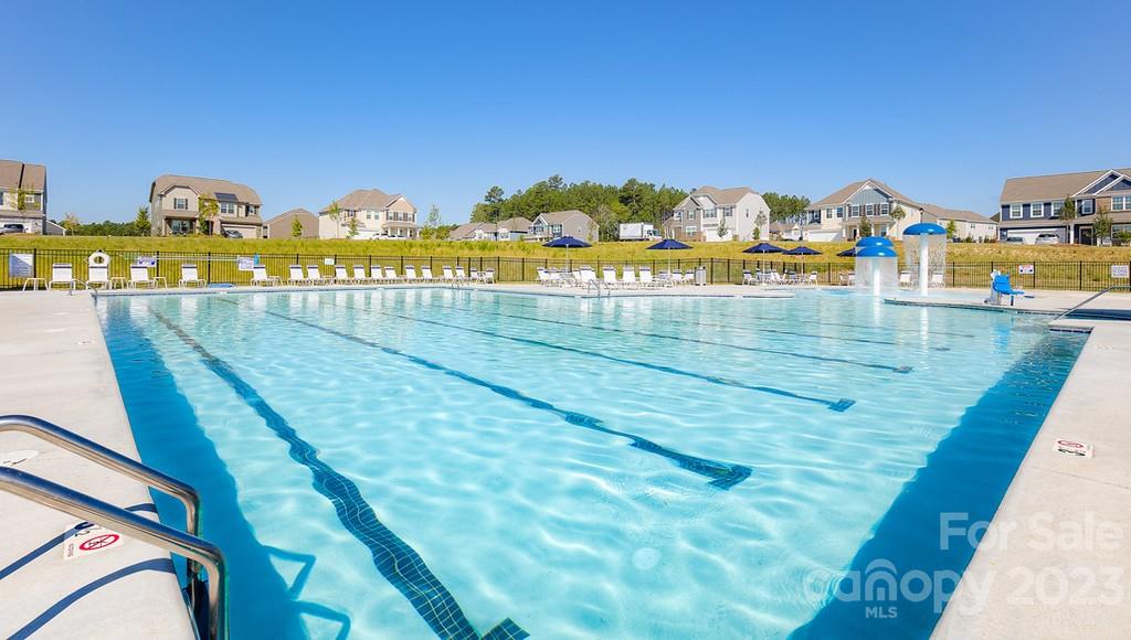 384 Streamwood Road Troutman, NC 28166 - Photo 34 of 36 a view of swimming pool with a lawn chairs
