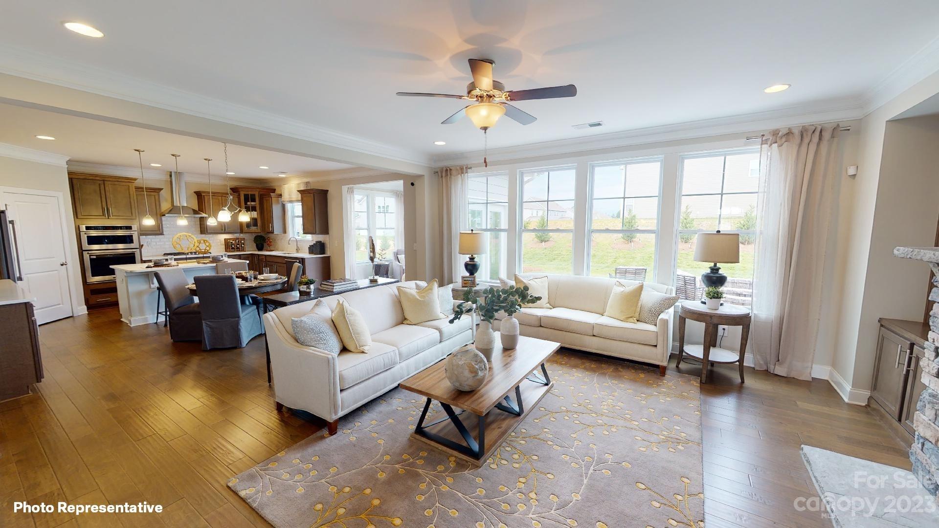 384 Streamwood Road Troutman, NC 28166 - Photo 7 of 36 a living room with furniture and a large window