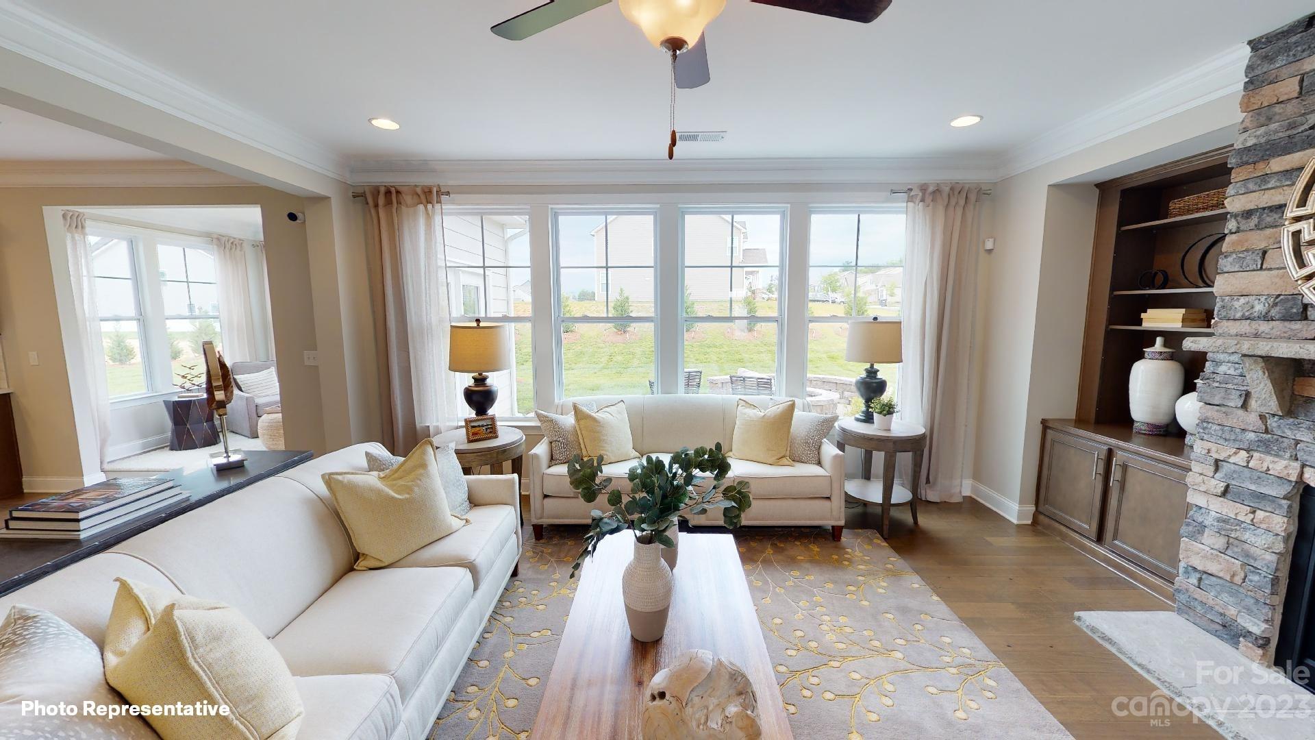 384 Streamwood Road Troutman, NC 28166 - Photo 8 of 36 a living room with furniture and a large window