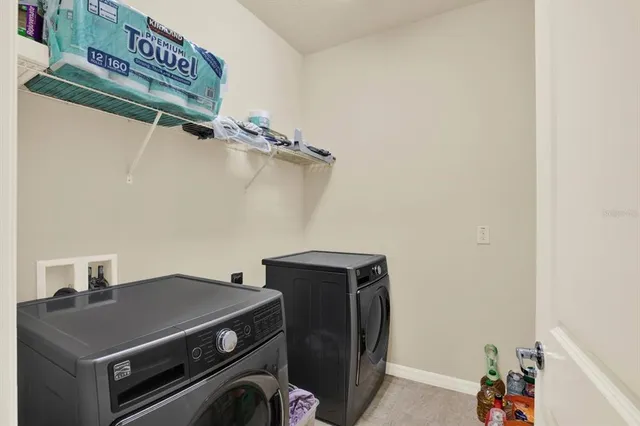 a utility room with dryer and washer