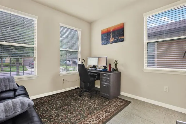 a workspace with furniture and window