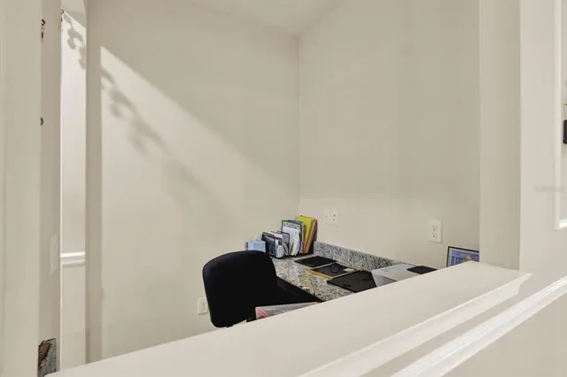 a bedroom with a bed and a chair