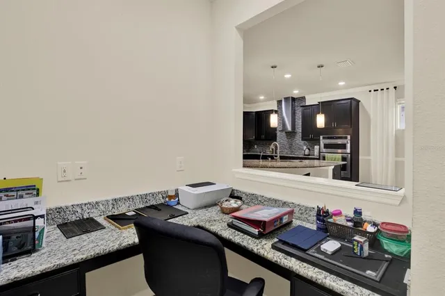 a kitchen with granite countertop lots of counter top space