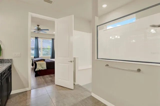 a walk in closet and a window in a room