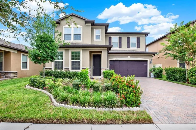 front view of a house with a yard
