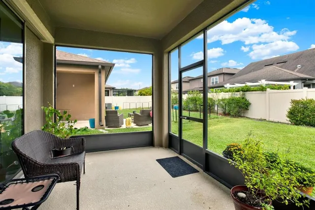 a room with garden filled with furniture and a potted plant