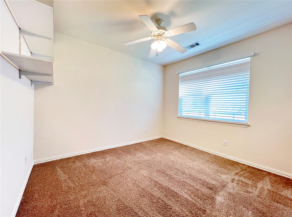 7517 Rodeo Drive Denton, TX 76208 - Photo 18 of 30 an empty room with windows