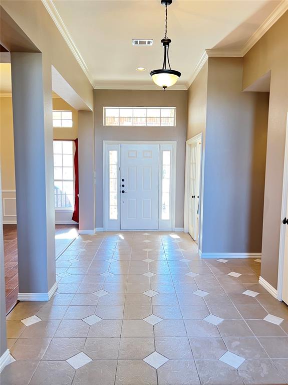 7517 Rodeo Drive Denton, TX 76208 - Photo 2 of 30 a view of a hallway with furniture and a window