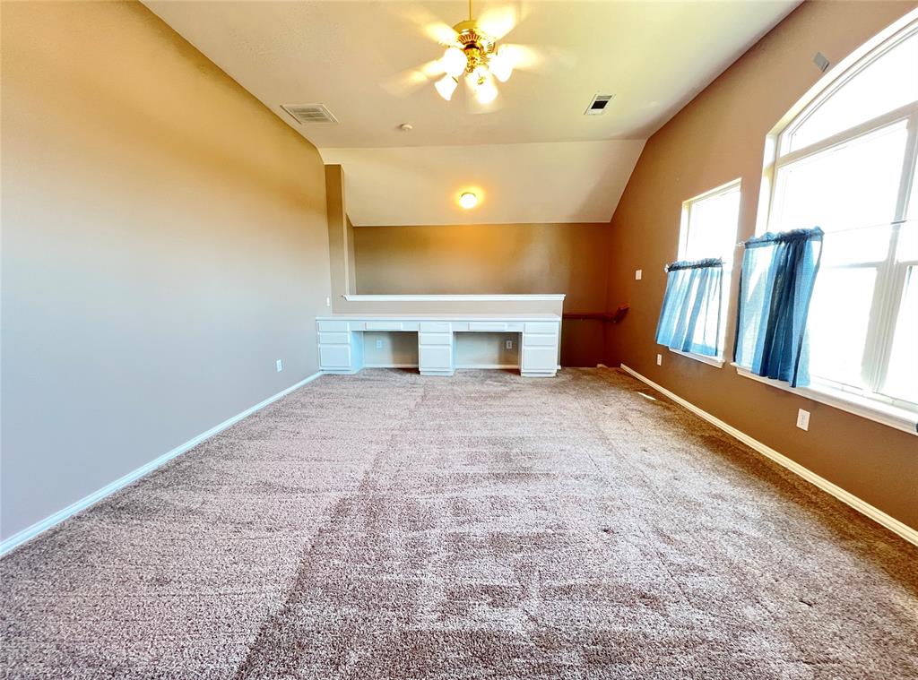 7517 Rodeo Drive Denton, TX 76208 - Photo 21 of 30 a view of livingroom with fireplace and window