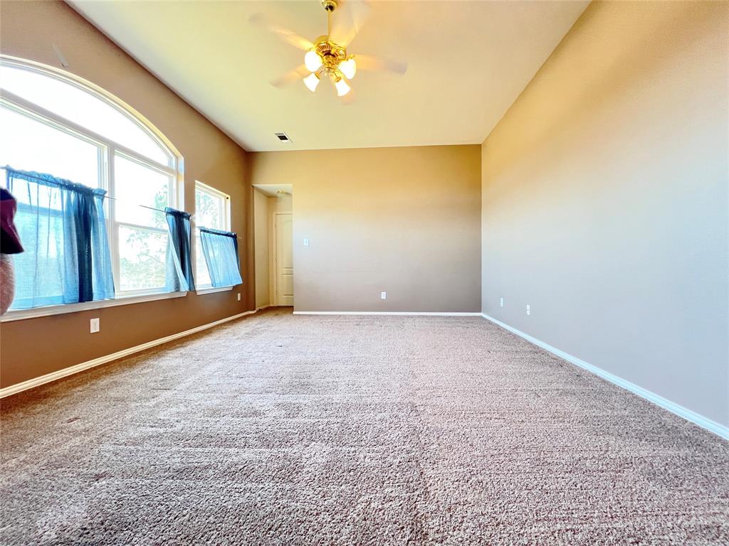7517 Rodeo Drive Denton, TX 76208 - Photo 22 of 30 a view of an empty room with a window