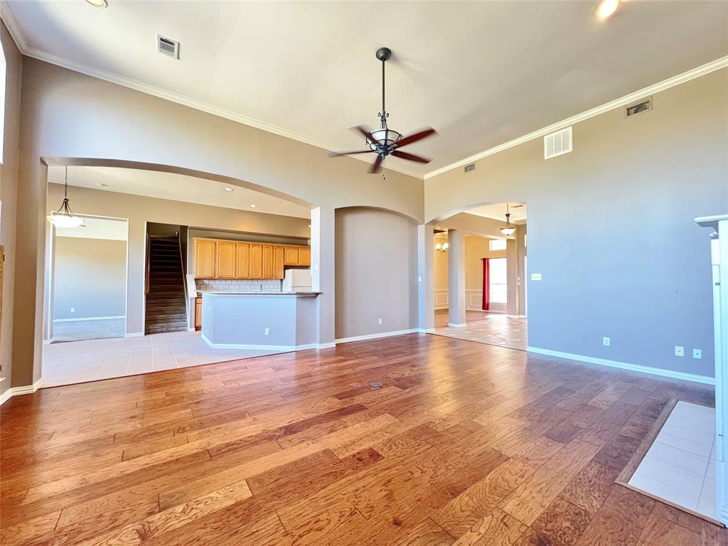 7517 Rodeo Drive Denton, TX 76208 - Photo 9 of 30 a view of an empty room with window and a ceiling fan