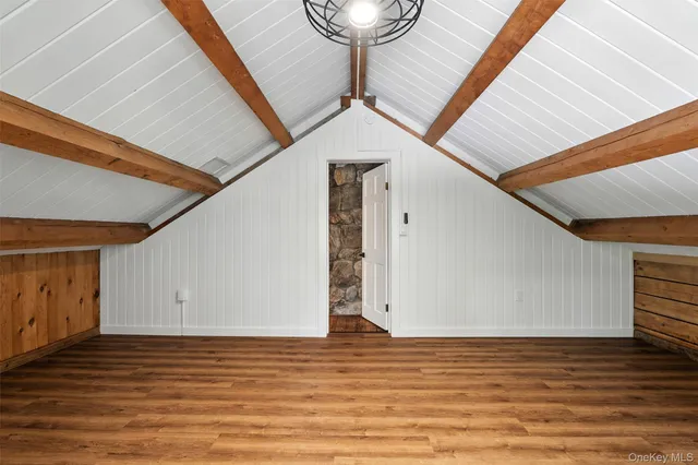 a view of a livingroom with wooden floor